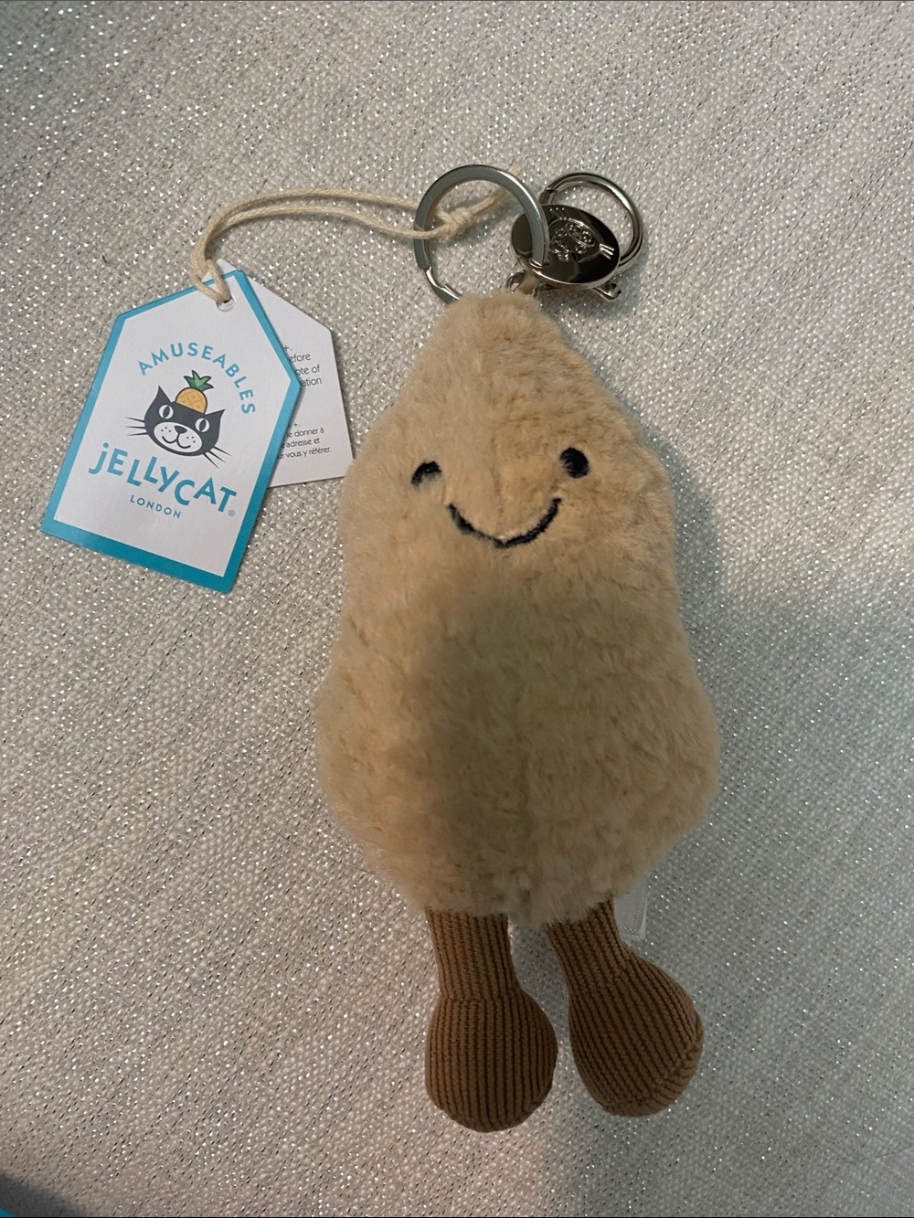 Jellycat Beige Smiling Plush Keychain with Brown Legs